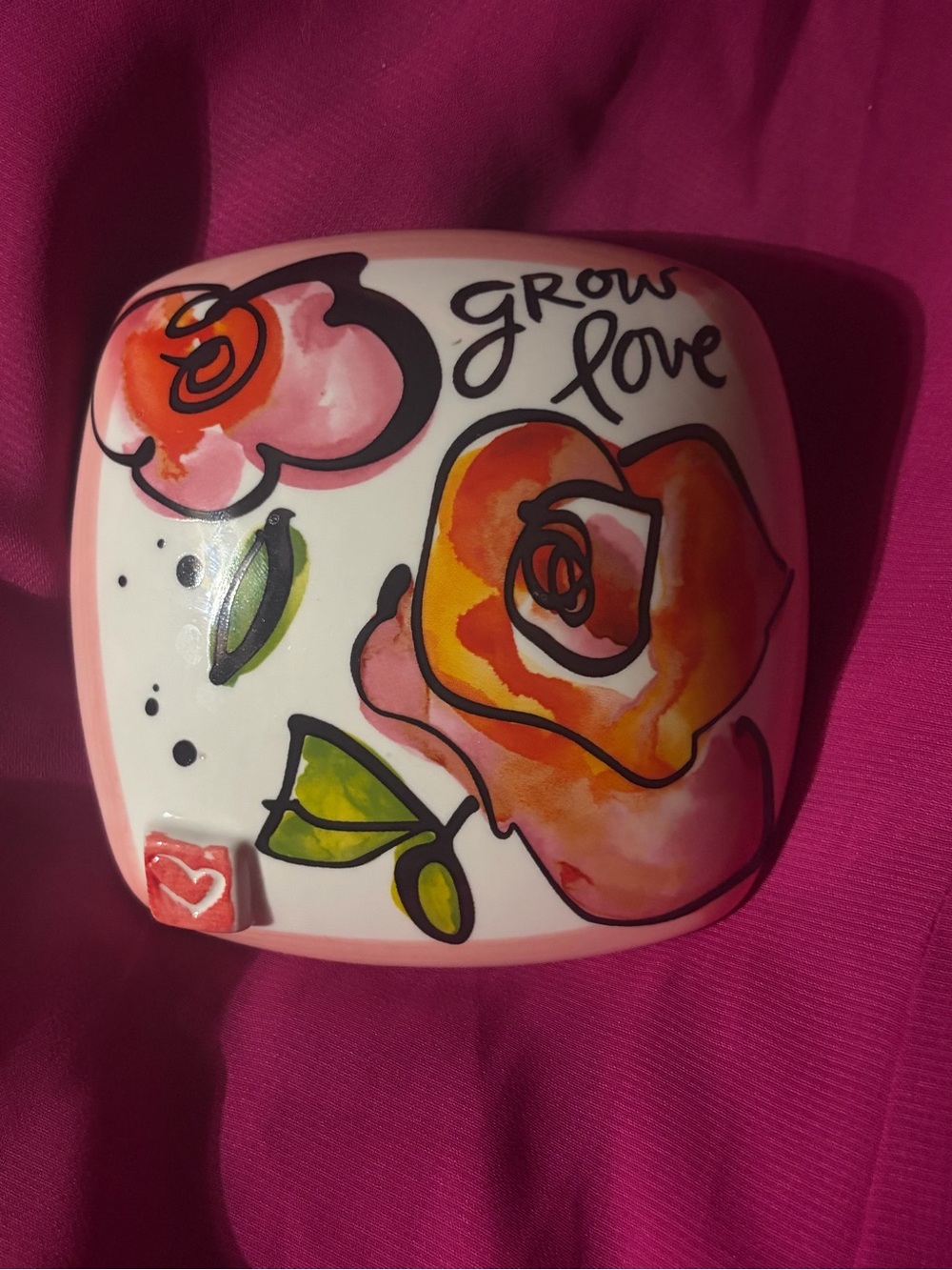 Ceramic floral wall hanging by Kathy Davis